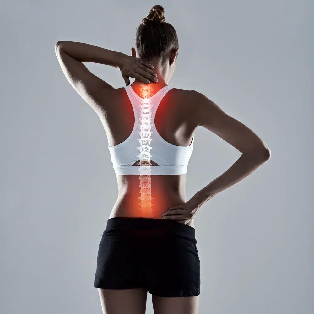 Chiropractic care for back pain relief in Kent County, Michigan, helping women regain mobility and comfort with expert treatments at Chiropractic First